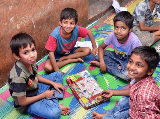 kids group learning arts and crafts in day care centre